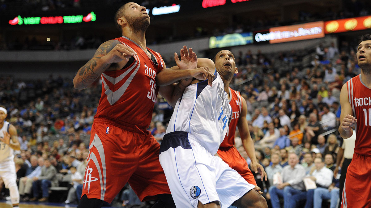 Houston Rockets forward Royce White (30) and Dallas Mavericks forward Brandan Wright (34) battle for position under the basket during the second quarter at the American Airlines Center. 