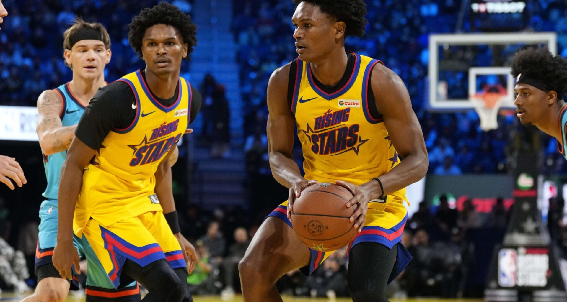 Team M guard Ausar Thompson (9) of the Detroit Pistons and Team M guard Amen Thompson (1) of the Houston Rockets control the ball during the 2025 NBA Rising Stars Game at Chase Center.