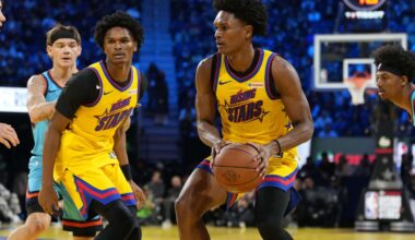 Team M guard Ausar Thompson (9) of the Detroit Pistons and Team M guard Amen Thompson (1) of the Houston Rockets control the ball during the 2025 NBA Rising Stars Game at Chase Center.