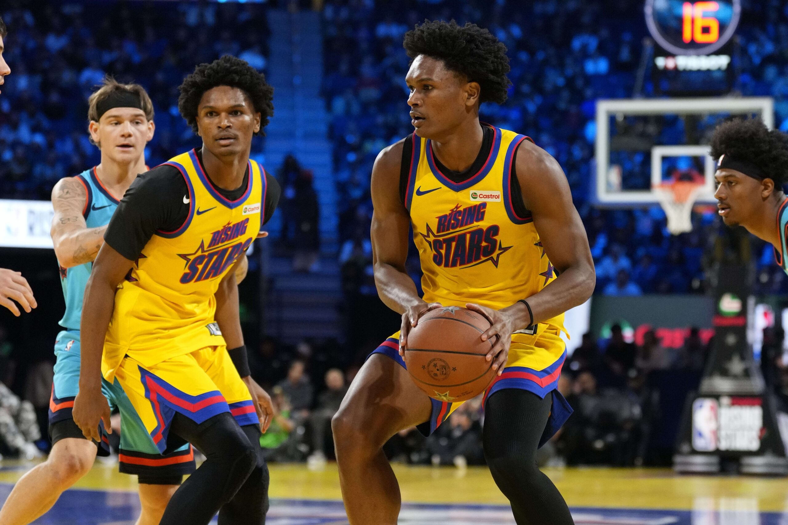 Team M guard Ausar Thompson (9) of the Detroit Pistons and Team M guard Amen Thompson (1) of the Houston Rockets control the ball during the 2025 NBA Rising Stars Game at Chase Center.