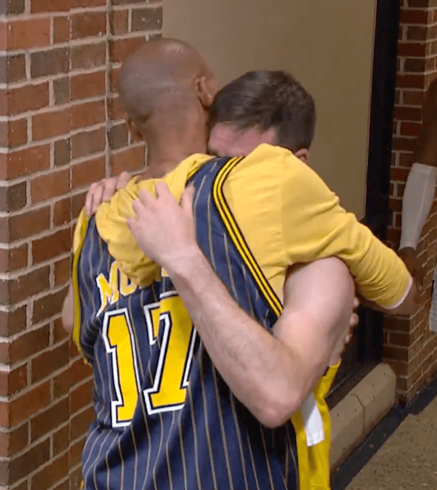 T.J. McConnell (R.) and Reggie Miller embrace after Game 7 of the NBA Finals on June 22, 2025. 