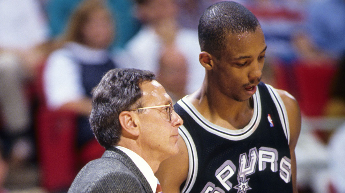 San Antonio Spurs head coach Larry Brown talks to guard Sean Elliott (32) against the Orlando Magic during the 1990-91 season at the Orlando Arena. 