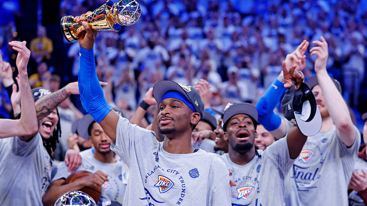 Oklahoma City Thunder guard Shai Gilgeous-Alexander (2) celebrates with Magic Johnson West Conference Finals MVP trophy after defeating the Minnesota Timberwolves in game five to win the western conference finals for the 2025 NBA Playoffs at Paycom Center.