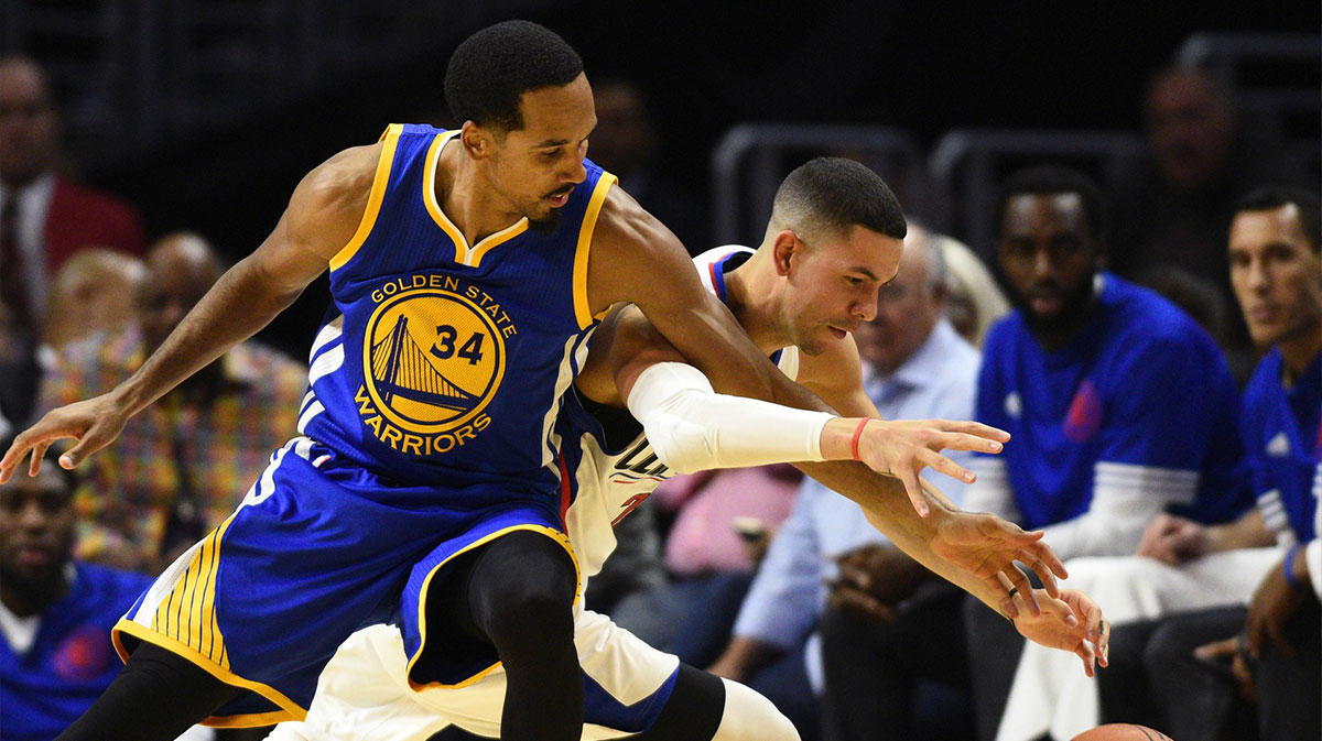 Golden State Warriors guard Shaun Livingston (34) and Los Angeles Clippers guard Austin Rivers (back) battle for the ball during the third quarter at Staples Center. The Los Angeles Clippers won 130-95.