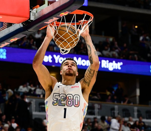 Denver's Michael Porter Jr. dunks against the Milwaukee Bucks in the first quarter at Ball Arena in Denver on Wednesday, March 26, 2025. (Photo by Andy Cross/The Denver Post)