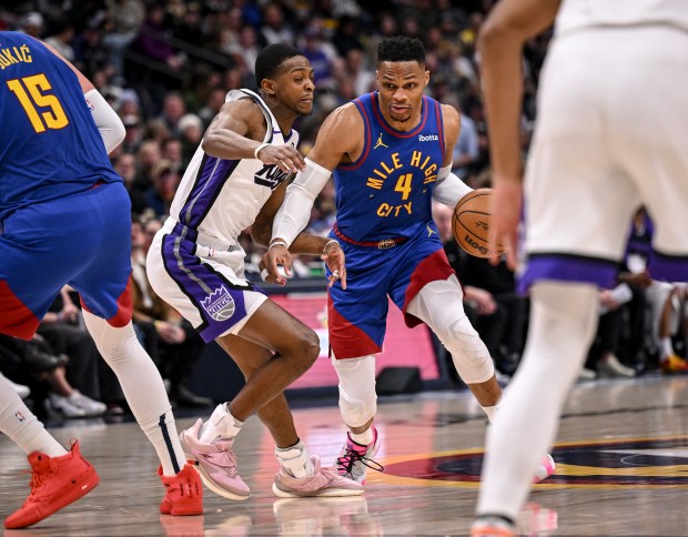 Russell Westbrook (4) of the Denver Nuggets drives on De'Aaron Fox (5) of the Sacramento Kings during the second quarter at Ball Arena in Denver on Thursday, Jan. 23, 2025. (Photo by AAron Ontiveroz/The Denver Post)