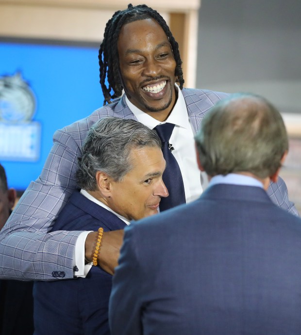 2025: Dwight Howard hugs Orlando Magic CEO Alex Martins as...