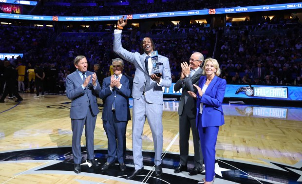 2025: Former Orlando center Dwight Howard is honored as an...