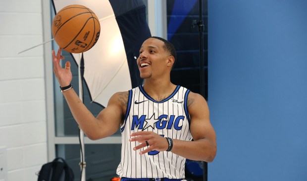 Orlando Magic guard Desmond Bane spins the ball on his...