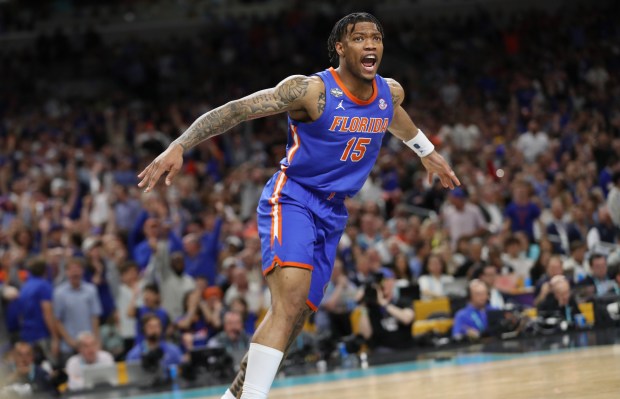 Florida guard Alijah Martin celebrates after a slam dunk during the NCAA Final Four college basketball game of Florida versus Auburn at the Alamodome in San Antonio Texas on Saturday, April 5, 2025. Florida won the game 79-73 to advance to the championship game. (Stephen M. Dowell/Orlando Sentinel)