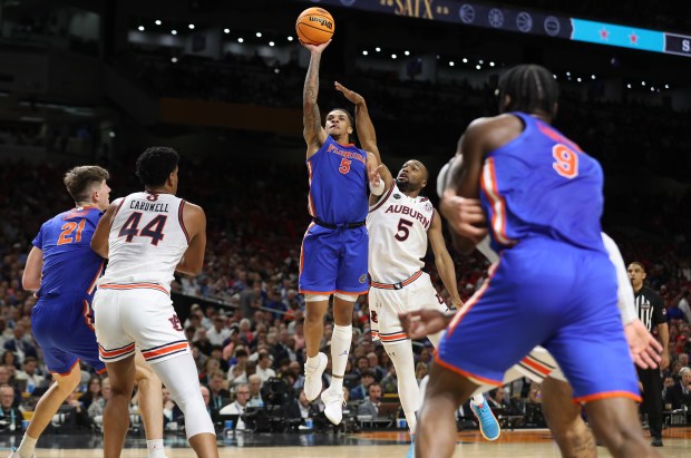 Florida guard Will Richards (5) shoots during the NCAA Final Four college basketball game of Florida versus Auburn at the Alamodome in San Antonio Texas on Saturday, April 5, 2025. Florida won the game 79-73 to advance to the championship game. (Stephen M. Dowell/Orlando Sentinel)