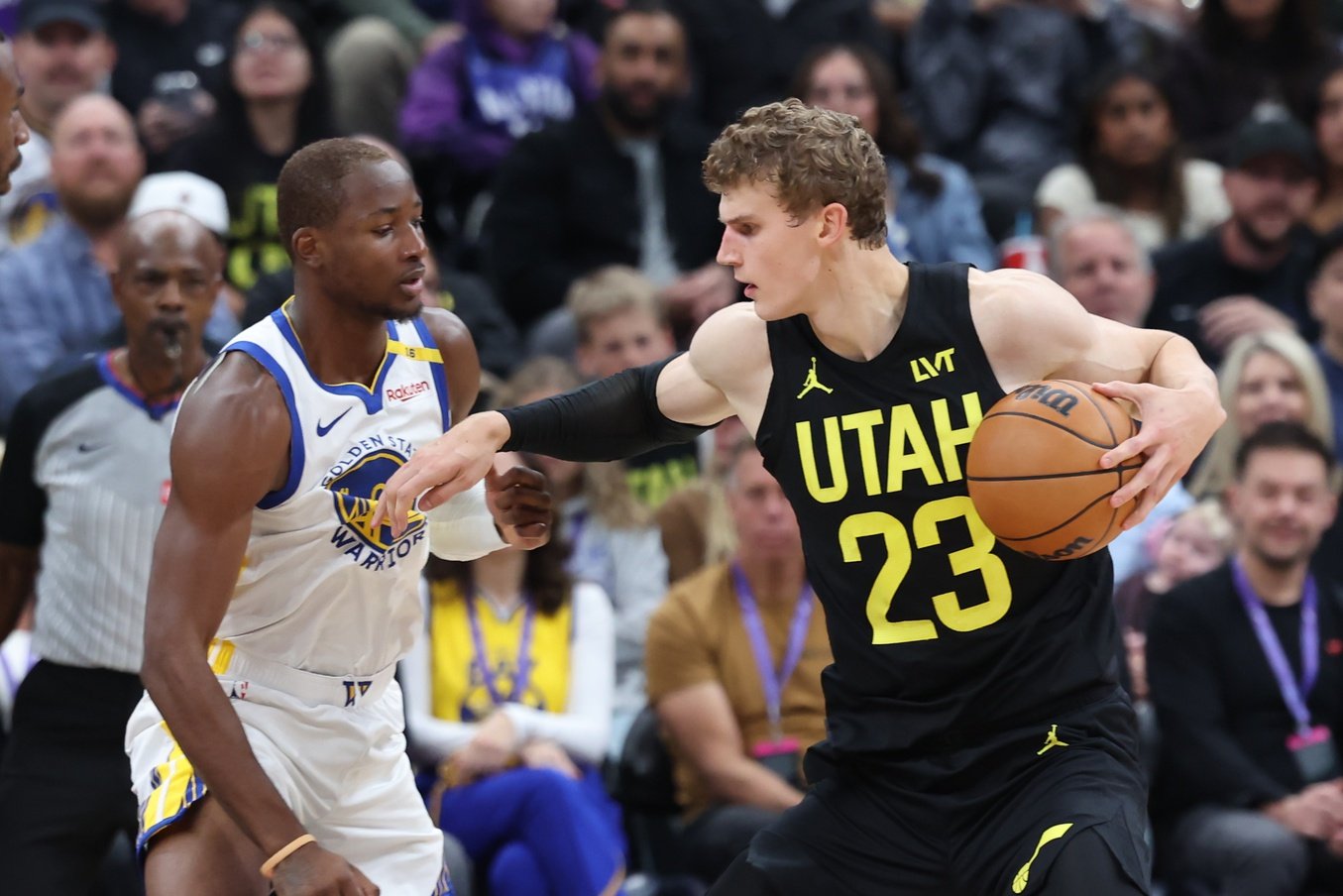 Oct 25, 2024; Salt Lake City, Utah, USA; Utah Jazz forward Lauri Markkanen (23) posts up on Golden State Warriors forward Jonathan Kuminga (00) during the second quarter at Delta Center. Mandatory Credit: Rob Gray-Imagn Images