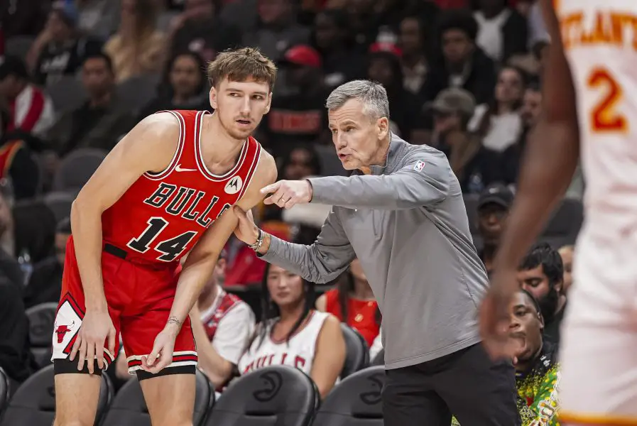Chicago Bulls head coach Billy Donovan instructs forward Matas Buzelis (14) during the game against the Atlanta Hawks during the first half at State Farm Arena.