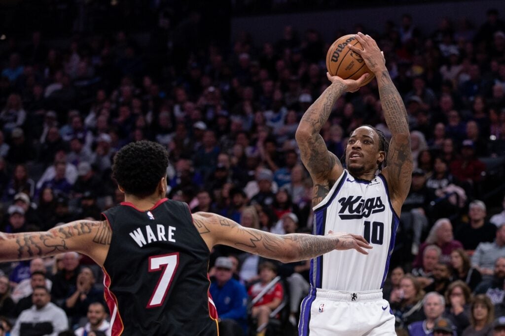 Jan 6, 2025; Sacramento, California, USA; Sacramento Kings forward DeMar DeRozan (10) takes a jump shot during the third quarter against the Miami Heat at Golden 1 Center. Mandatory Credit: Ed Szczepanski-Imagn Images