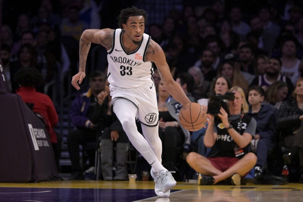 Jan 17, 2025; Los Angeles, California, USA; Brooklyn Nets center Nic Claxton (33) handles the ball against the Los Angeles Lakers at Crypto.com Arena. Mandatory Credit: Jayne Kamin-Oncea-Imagn Images