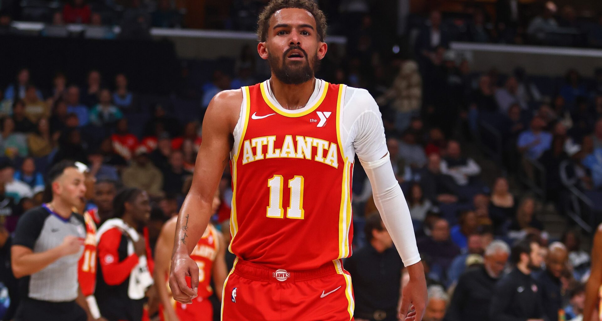 Hawks star Trae Young walks off the court against the Grizzlies during the 2024-25 NBA season.