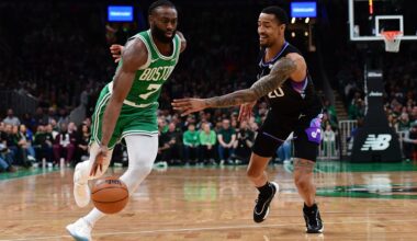 Boston Celtics wing Jaylen Brown blows past Utah Jazz big man John Collins