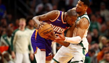 Phoenix Suns forward Kevin Durant (35) handles the ball against Milwaukee Bucks forward Giannis Antetokounmpo (34) during the fourth quarter at Footprint Center.