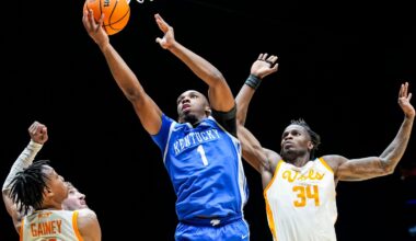 Kentucky Wildcats guard Lamont Butler (1) goes up for a basket against Tennessee Volunteers guard Jordan Gainey (11) and Tennessee Volunteers forward Felix Okpara (34) on Friday, March 28, 2025, during the NCAA Tournament Sweet 16 game at Lucas Oil Stadium in Indianapolis.