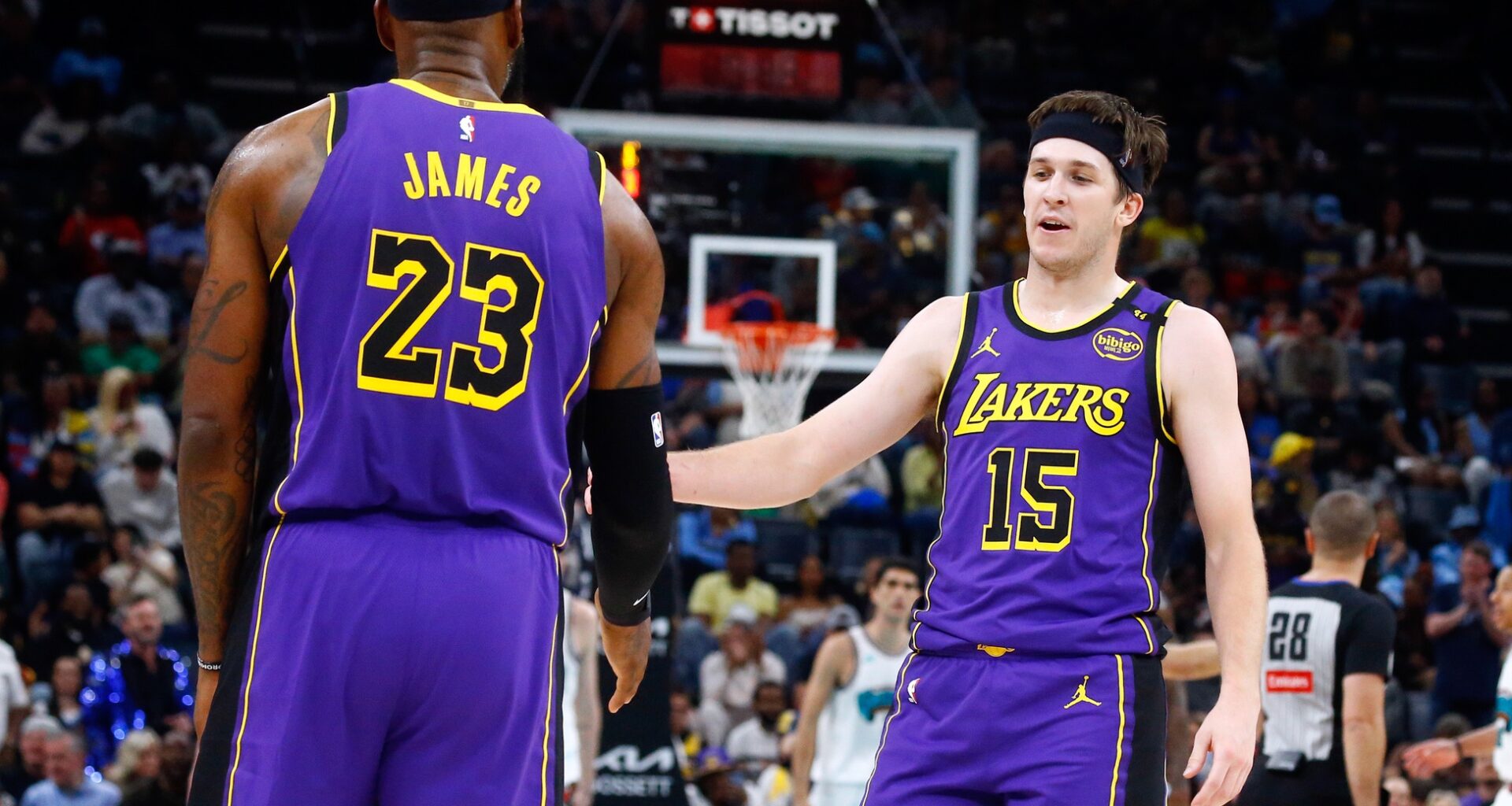 Mar 29, 2025; Memphis, Tennessee, USA; Los Angeles Lakers guard Austin Reaves (15) reacts with forward LeBron James (23) during the second quarter against the Memphis Grizzlies at FedExForum. Mandatory Credit: Petre Thomas-Imagn Images
