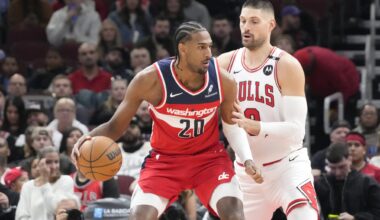 Apr 11, 2025; Chicago, Illinois, USA; Chicago Bulls center Nikola Vucevic (9) defends Washington Wizards forward Alex Sarr (20) during the first quarter at United Center. Mandatory Credit: David Banks-Imagn Images
