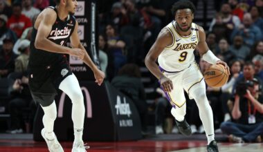 Apr 13, 2025; Portland, Oregon, USA; Los Angeles Lakers guard Bronny James (9) brings the ball up the court past Portland Trail Blazers forward Kris Murray (24) in the second half at Moda Center. Mandatory Credit: Jaime Valdez-Imagn Images