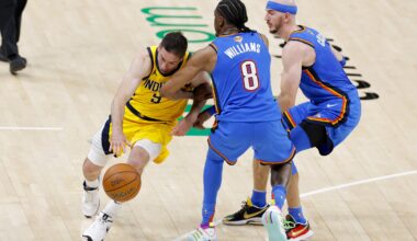 Indiana Pacers guard T.J. McConnell (9) drives to the basket past Oklahoma City Thunder forward Jalen Williams (8) and guard Alex Caruso (9) during the fourth quarter of game two of the 2025 NBA Finals at Paycom Center.