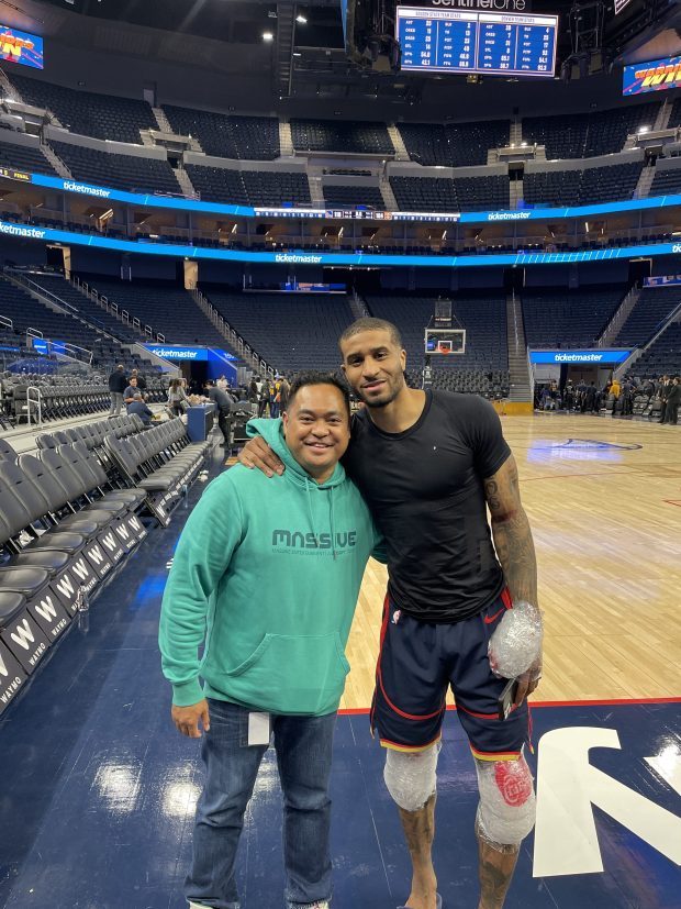 Chris Navalta, left, poses for a photo with Golden State Warriors guard Gary Payton II. Payton II was instrumental in helping Navalta get started with his upcoming children's book: "Basketball Stars: Stories and Skills from the NBA's and WNBA's Best Players." (Photo courtesy of Chris Navalta)