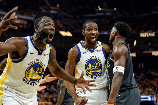 The Warriors' Draymond Green, left, and Jonathan Kuminga react to a foul call during Game 3 of the Western Conference semifinals against the Timberwolves on May 10, 2025, in San Francisco. (Carlos Avila Gonzalez/San Francisco Chronicle via AP)