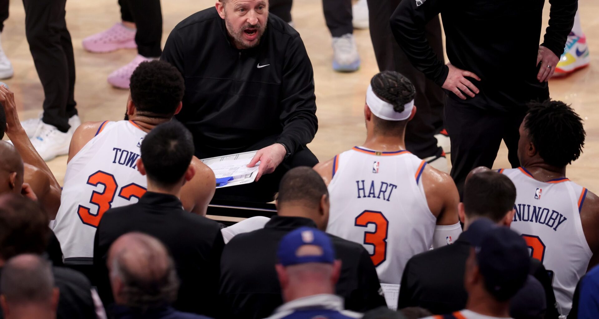 New York Knicks head coach Tom Thibodeau talks to center Karl-Anthony Towns (32) and guard Josh Hart (3) and forward OG Anunoby (8) during a time out during the third quarter of game six in the second round of the 2025 NBA Playoffs against the Boston Celtics at Madison Square Garden.