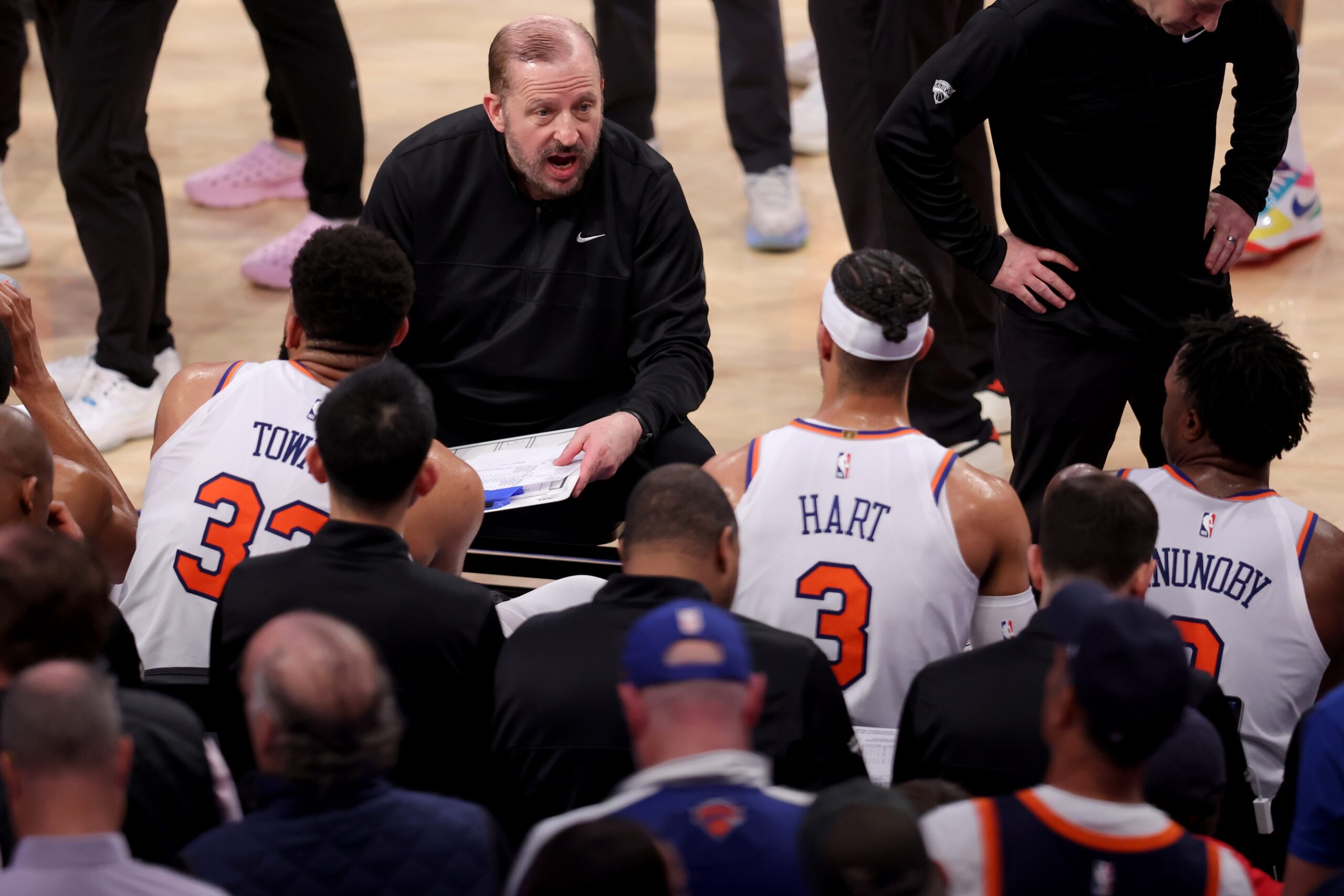 New York Knicks head coach Tom Thibodeau talks to center Karl-Anthony Towns (32) and guard Josh Hart (3) and forward OG Anunoby (8) during a time out during the third quarter of game six in the second round of the 2025 NBA Playoffs against the Boston Celtics at Madison Square Garden.