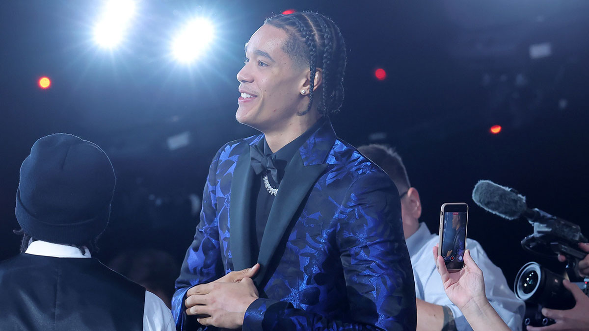 Yanic Konan Niederhauser walks on stage after being selected as the 30th pick by the Los Angeles Clippers in the first round of the 2025 NBA Draft at Barclays Center.