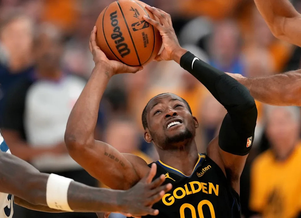 May 12, 2025; San Francisco, California, USA; Golden State Warriors forward Jonathan Kuminga (00) is fouled while attempting a shot between Minnesota Timberwolves forward Julius Randle (30) and center Rudy Gobert (27) in the fourth quarter during game four of the second round for the 2025 NBA Playoffs at Chase Center. Mandatory Credit: Cary Edmondson-Imagn Images Mandatory Credit&colon; Cary Edmondson-Imagn Images