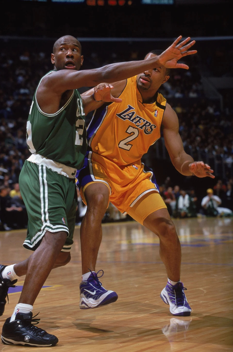 25 Feb 2000: Doug Overton #20 of the Boston Celtics gaurds Derek Fisher #2 of the Los Angeles Lakers during the game at Staples Center in Los Angeles, California. The Lakers defeated the Celtics 109-96.. Mandatory Credit: Tom Hauck /Allsport