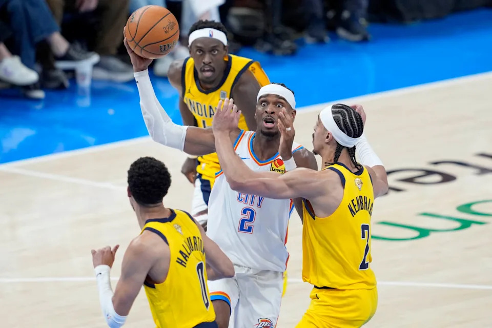 Oklahoma City Thunder guard Shai Gilgeous-Alexander (2) drives to the basket between Indiana Pacers guard Tyrese Haliburton (0), guard Andrew Nembhard (2) and forward Pascal Siakam (43) during Game 1 of the NBA Finals between the Oklahoma City Thunder and the Indiana Pacers at Paycom Center in Oklahoma City, Thursday, June 5, 2025. Indiana won 111-110.