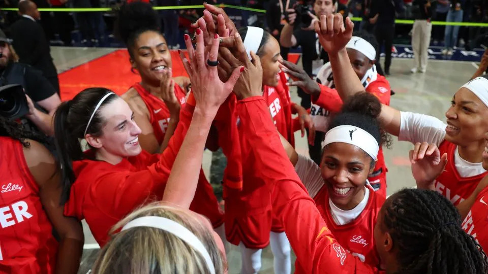 The Fever huddle after their season-opening win over Chicago. - Gregory Shamus/Getty Images