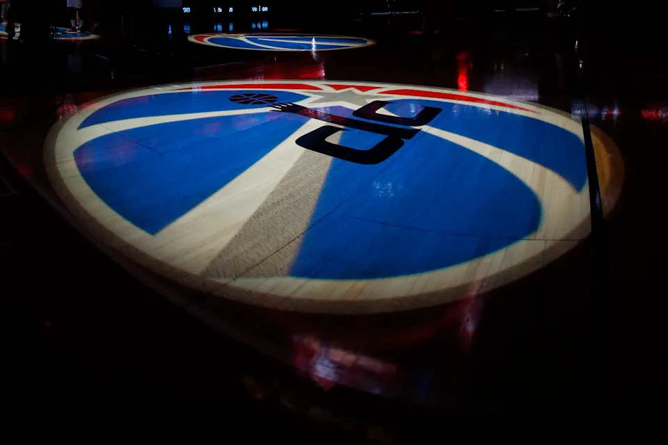The Washington Wizards logo is projected on the court during player intros.Geoff Burke-Imagn Images
