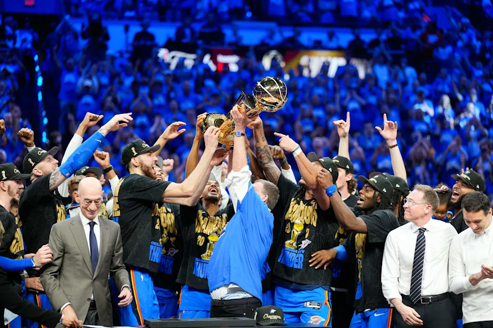 Jun 22, 2025; Oklahoma City, Oklahoma, USA; The Oklahoma City Thunder lift the Larry O'Brien Championship Trophy as they celebrate after winning game seven of the 2025 NBA Finals against the Indiana Pacers at Paycom Center. Mandatory Credit: Kyle Terada-Imagn Images