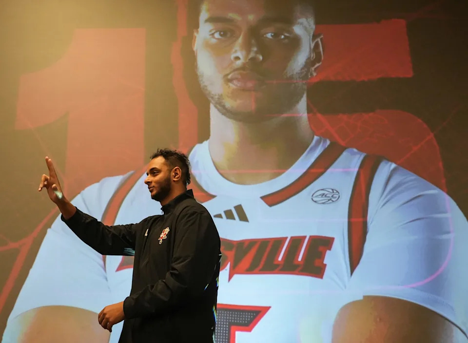 Louisville center Aly Khalifa walks towards the stage as they're introduced at the men's basketball luncheon Monday afternoon at The Galt House hotel. Oct. 7, 2024
