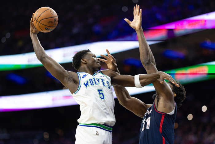 Minnesota Timberwolves guard Anthony Edwards (5) drives for a shot against Philadelphia 76ers center Joel Embiid (21) during the second quarter at Wells Fargo Center.