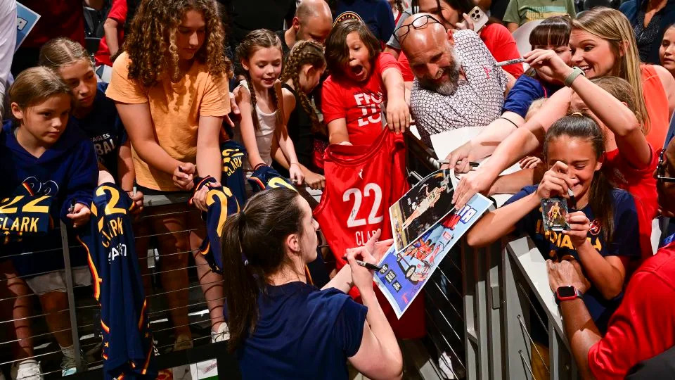 Caitlin Clark signs autographs for fans in Atlanta on May 22. - Adam Hagy/NBAE/Getty Images
