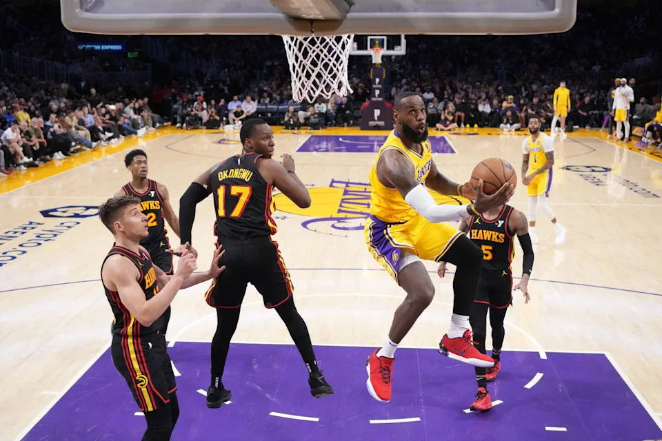 Los Angeles Lakers forward LeBron James shoots the ball against Atlanta Hawks forward Onyeka Okongwu.Kirby Lee-Imagn Images