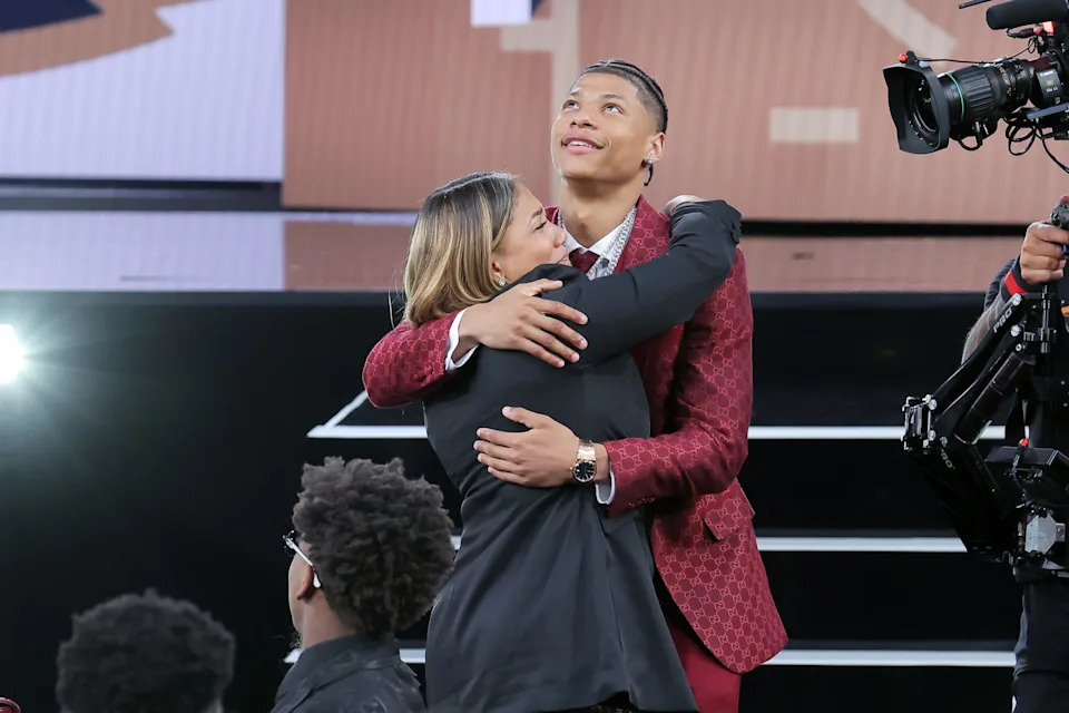 Jun 25, 2025; Brooklyn, NY, USA; Jeremiah Fears celebrates with family after being selected as the seventh pick by the New Orleans Pelicans in the first round of the 2025 NBA Draft at Barclays Center. Mandatory Credit: Brad Penner-Imagn Images