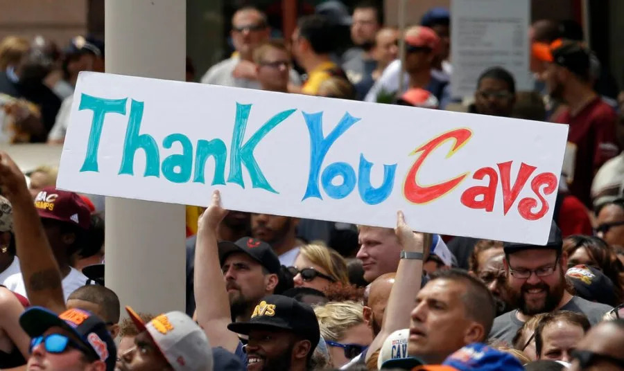 Fans hold up a sign waiting for the Cleveland Cavaliers to arrive at a rally, Wednesday, June 22, 2016, in Cleveland. The Cavaliers made history by overcoming a 3-1 deficit to beat the Golden State Warriors in the NBA Finals and end the city’s 52-year drought without a professional sports championship. (AP Photo/Tony Dejak)