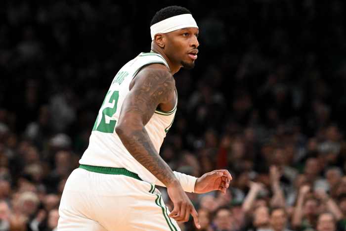 Feb 12, 2025; Boston, Massachusetts, USA; Boston Celtics forward Torrey Craig (12) runs up the court during the second quarter of a game against the San Antonio Spurs at the TD Garden. Mandatory Credit: Brian Fluharty-Imagn Images