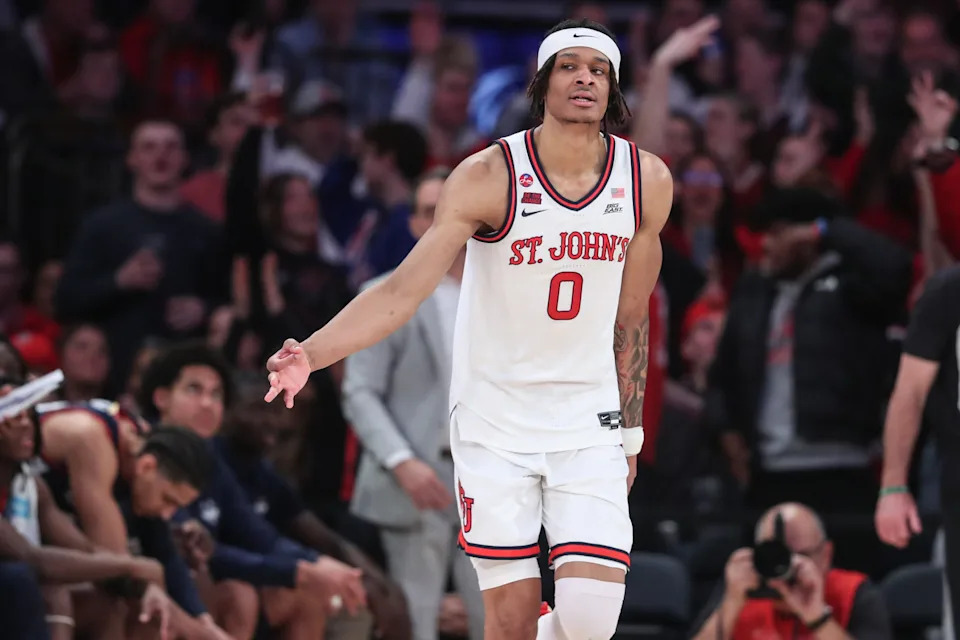 Feb 23, 2025; New York, New York, USA; St. John's Red Storm guard Aaron Scott (0) reacts after making a three point shot in the first half against the Connecticut Huskies at Madison Square Garden. Mandatory Credit: Wendell Cruz-Imagn Images