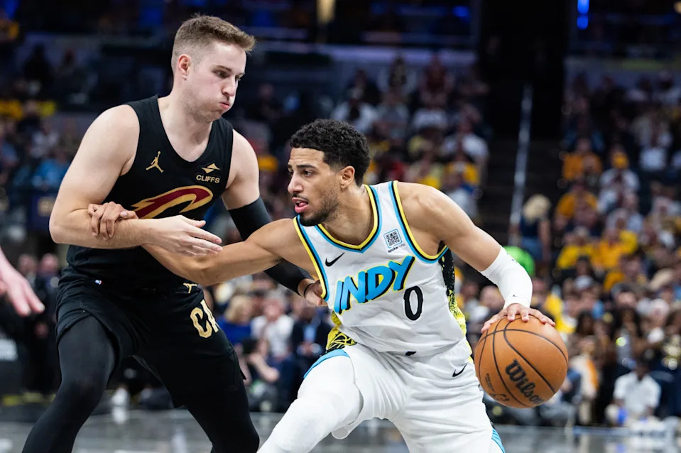 Indiana Pacers guard Tyrese Haliburton (0) dribbles the ball while Cleveland Cavaliers guard Sam Merrill (5) defends.Trevor Ruszkowski-Imagn Images