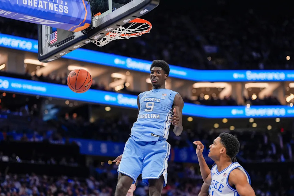 Mar 14, 2025; Charlotte, NC, USA; North Carolina Tar Heels guard Drake Powell (9) with a dunk against the Duke Blue Devils during the first half at Spectrum Center. Mandatory Credit: Jim Dedmon-Imagn Images