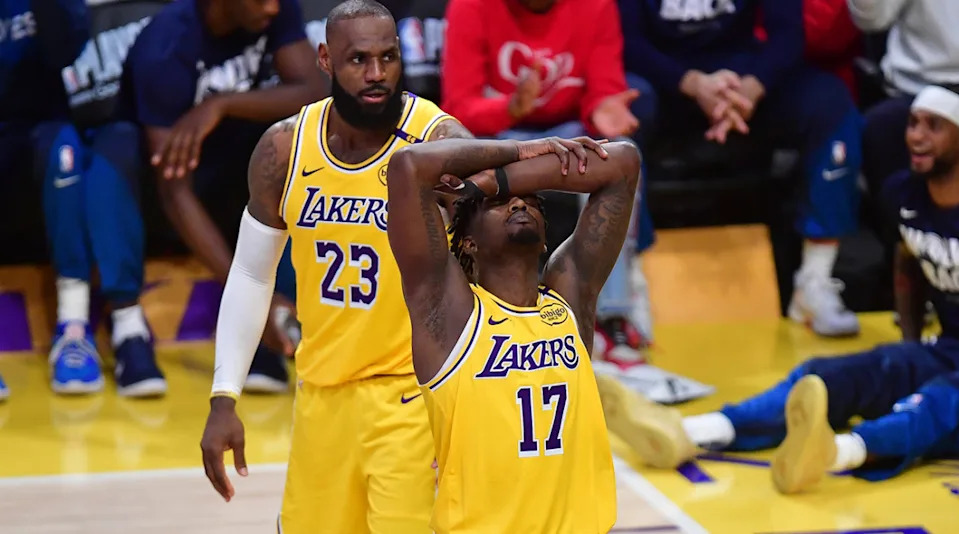 Los Angeles Lakers forward Dorian Finney-Smith reacts after being called for a foul as forward LeBron James looks on during Game 5 of their team's first-round playoff series against the Minnesota Timberwolves at Crypto.com Arena on April 30, 2025.Gary A. Vasquez-Imagn Images