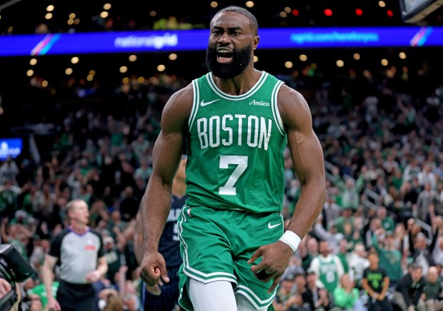 Jaylen Brown of the Boston Celtics screams out after dunking against Paolo Banchero of the Orlando Magic during the third quarter of an April 23 game. (Photo By Matt Stone/Boston Herald)